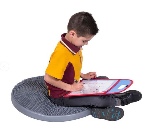 Child using Large Tactile Cushion